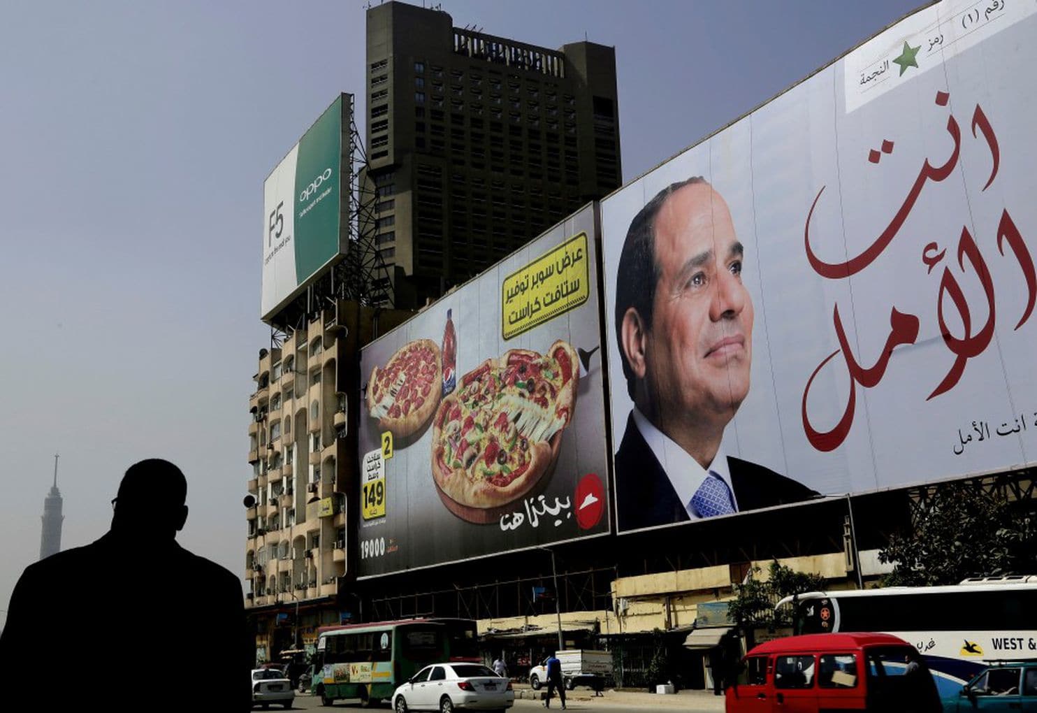 A banner shows Egyptian President Abdel Fatah al-Sissi with an Arabic message that reads, “You are the hope,” in Cairo on Wednesday. (Nariman El-Mofty/AP)